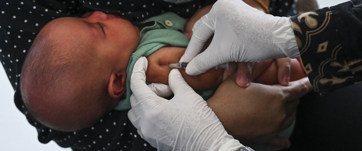 A baby receives the Bacillus Calmette-Guerin (BCG) vaccine for tuberculosis during a national immunization for children program at an integrated services post in Banda Aceh on June 9, 2022.(AFP/Chaideer Mahyuddin)