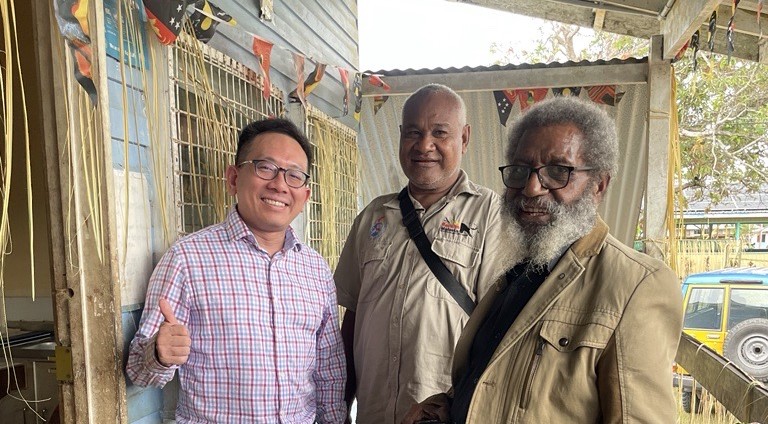 Photo of Mr Leo Makita (right) in the field with a team from APLMA and Rotarians Against Malaria Papua New Guinea. Credit: APLMA 2024 