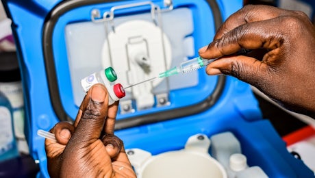A health worker measures the dosage of malaria vaccine in Ndhiwa, Homabay County, western Kenya on Sept. 13, 2019 during the launch of a malaria vaccine in Kenya. (AFP/Brian Ogoro)
