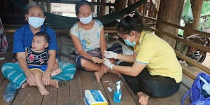 Thai Health worker, Sopa, tests a community member for malaria. / PMI - Photo by Pasin Yuwanakul, Inform Asia: USAID’s Health Research Program