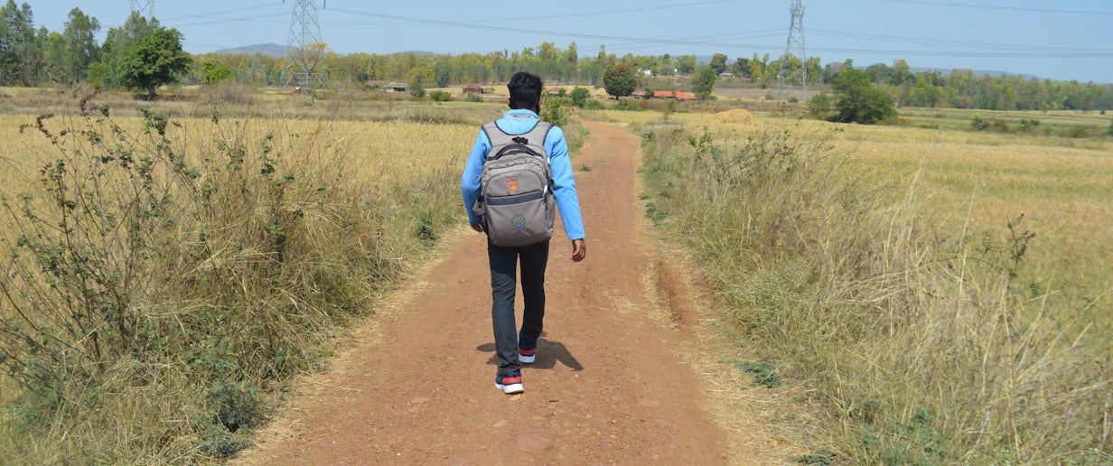 Field worker traveling between villages on foot in Mandla, India. Credit: MEDP Mandla 2021