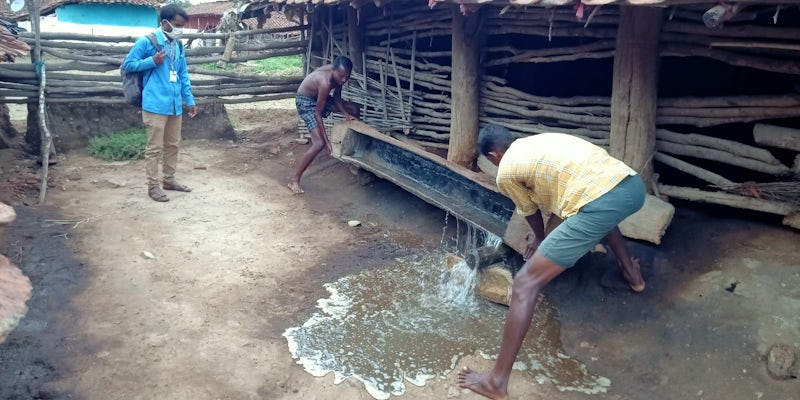 Field worker supervising draining of stagnant water in mandla india. medp mandla 2020