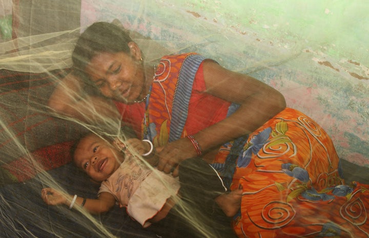 Mother and child under mosquito net in india photo by ehtisham husain pmi 2016 flickr